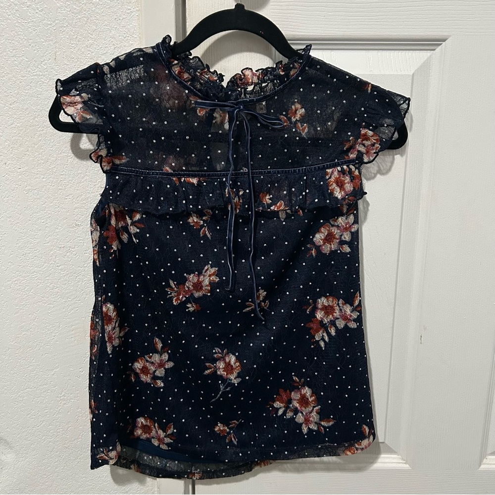 Navy blue floral blouse.